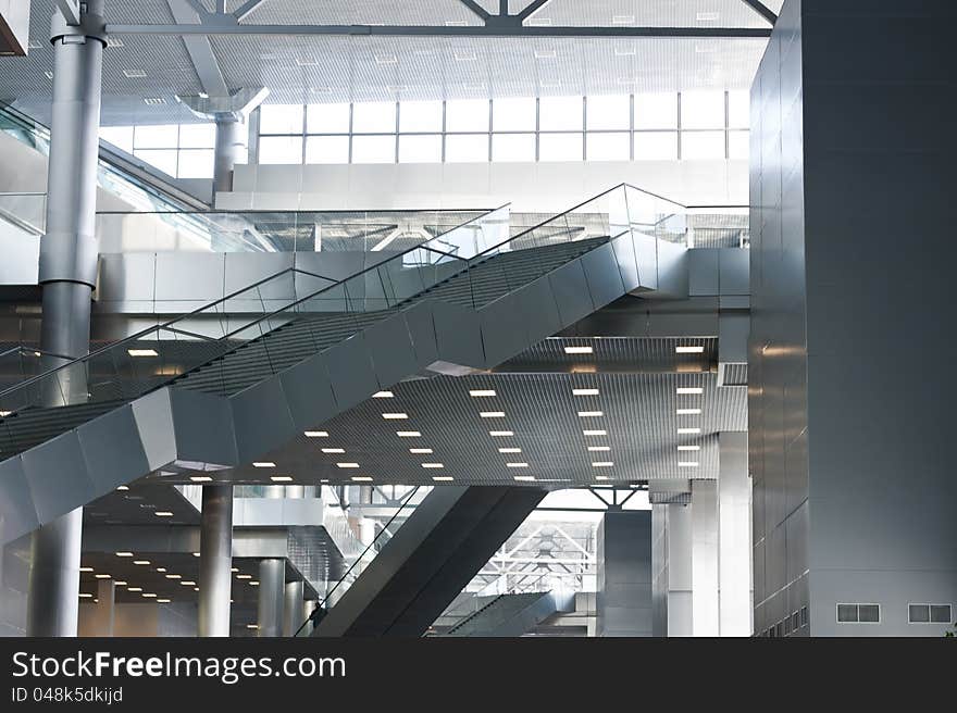 Modern Business Center Interior With Escalators