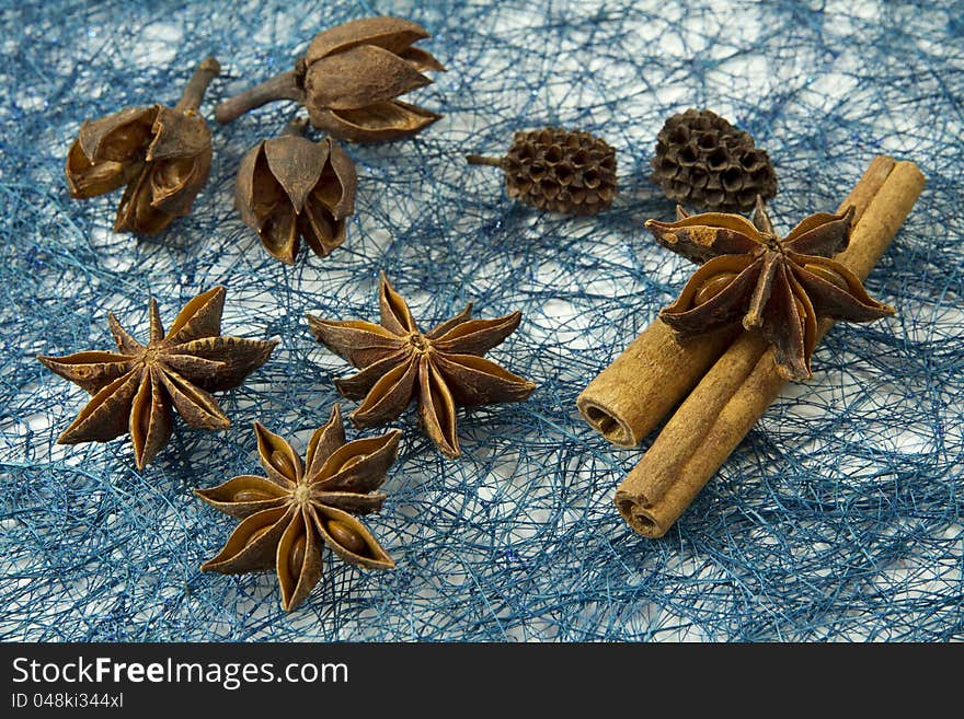 Anise And Cinnamon Over Blue Background