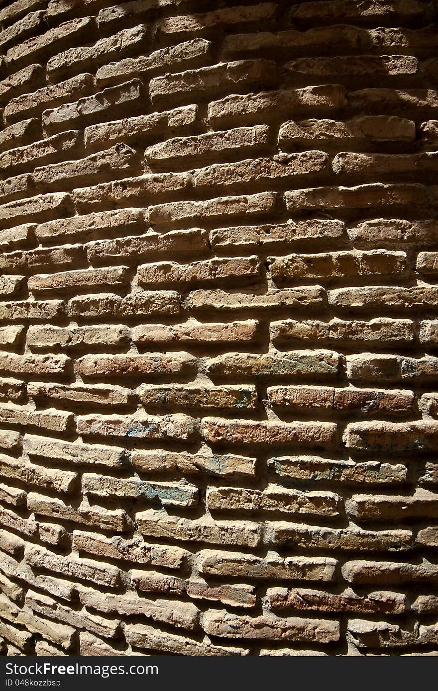 The old brickwork. Uneven surface, red-brown background. The old brickwork. Uneven surface, red-brown background