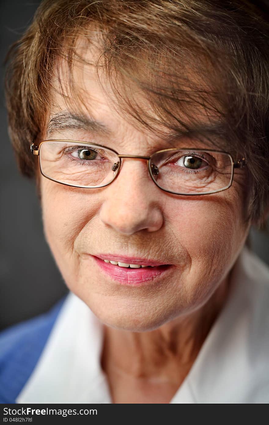 Senior woman portrait,  naturally and with eyeglasses