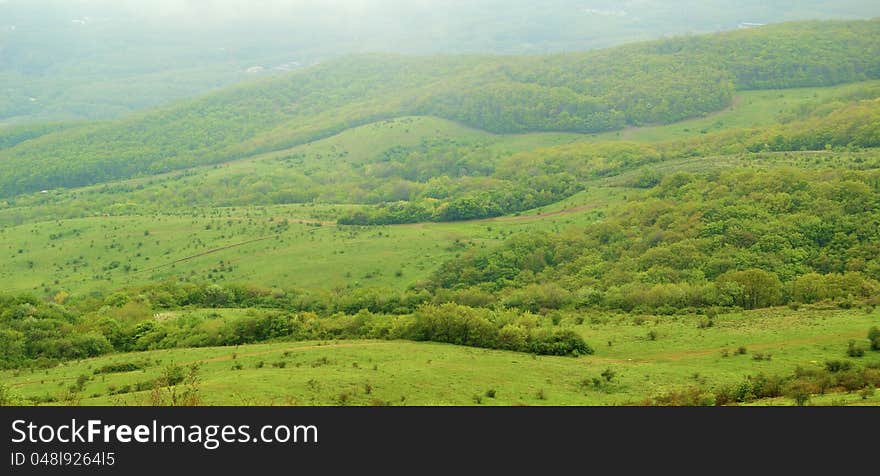 Panorama of Beautiful Valley in Fog. Top view.