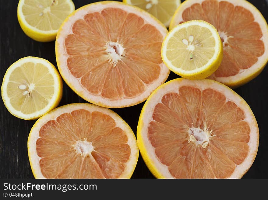 Group of fresh citrus fruits on a table, mandarines, clementines, tangerines, oranges, lemons, grapefruits