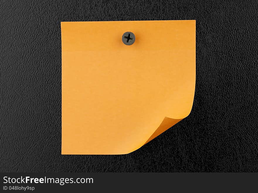 Yellow sticky note on black background