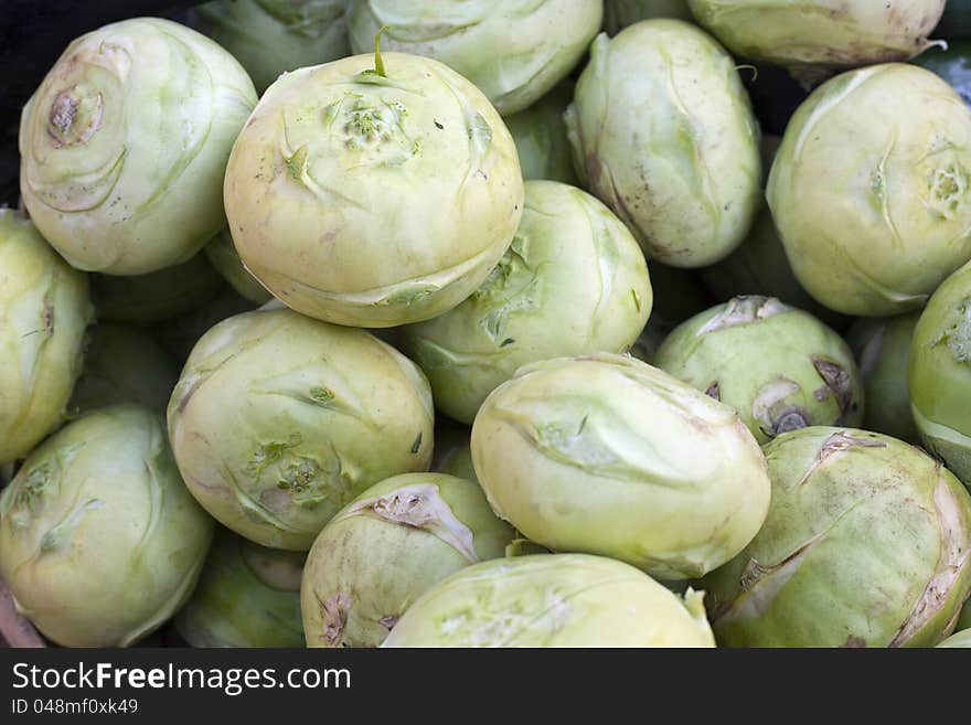 Group of fresh kohlrabi on a market. Group of fresh kohlrabi on a market