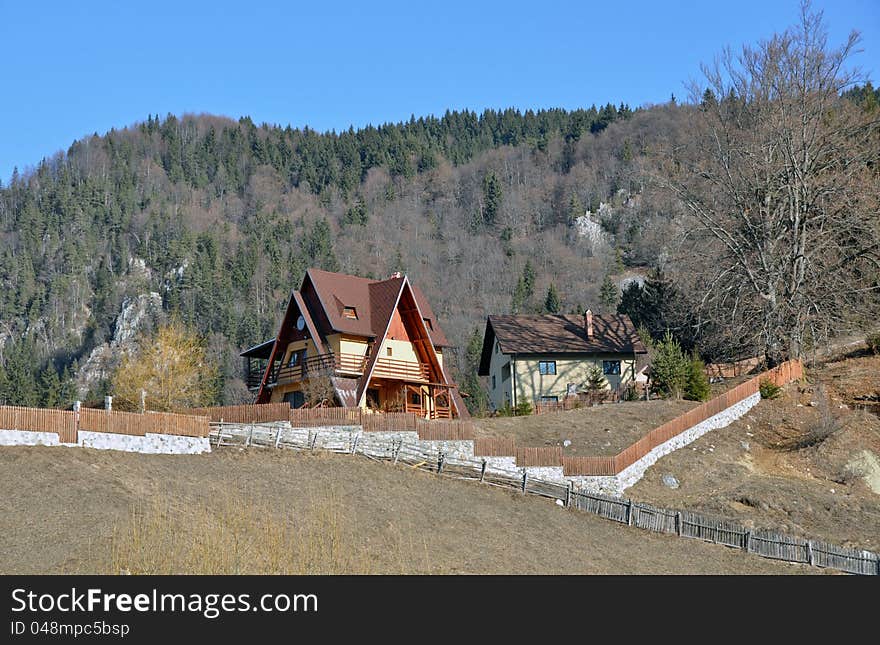 Wooden cottage in sunny winter day near pine forest. Wooden cottage in sunny winter day near pine forest