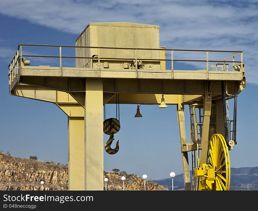 Yellow crane against blue sky