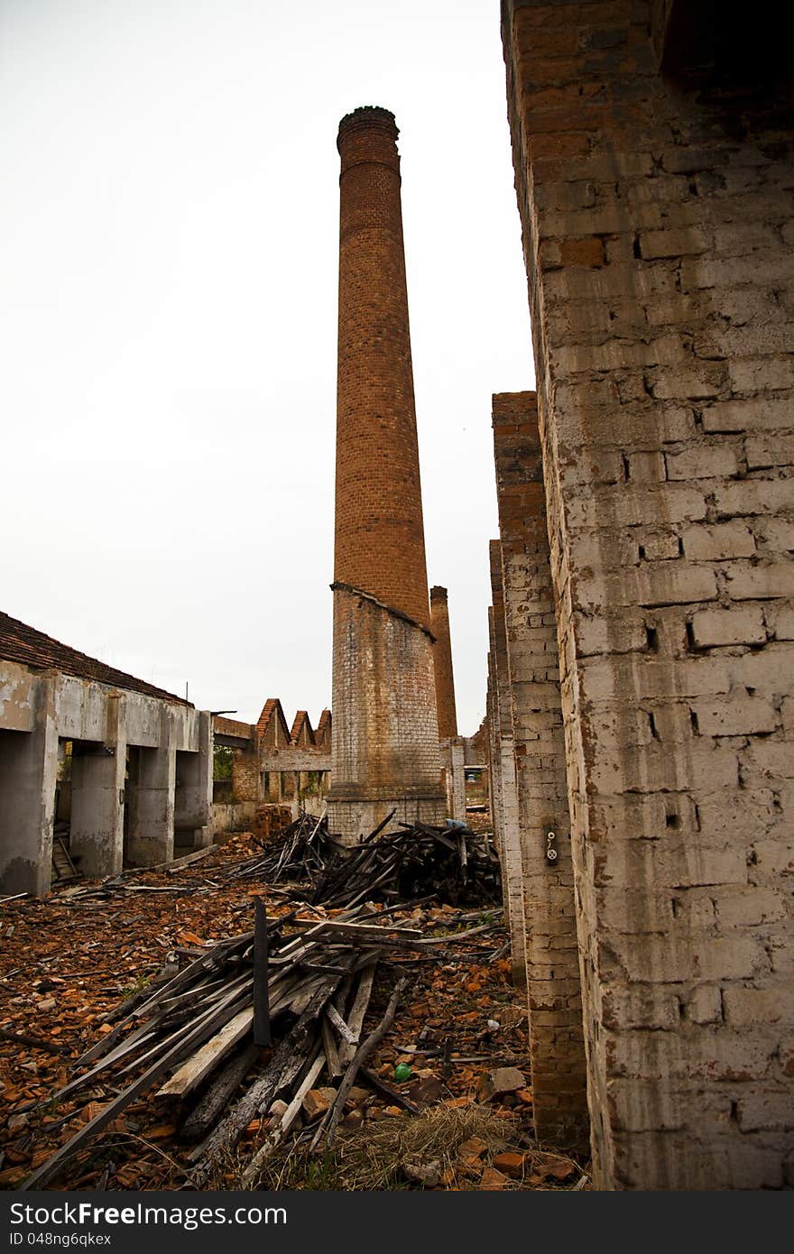 Ruins of a old plant / factory with industrial brick chimney