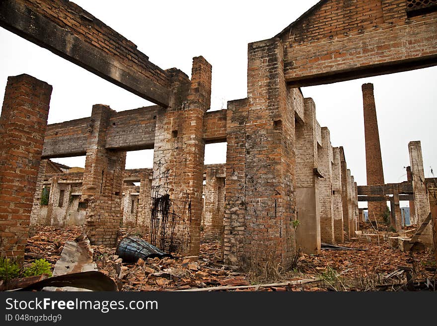 Ruins of a old plant / factory with industrial brick chimney