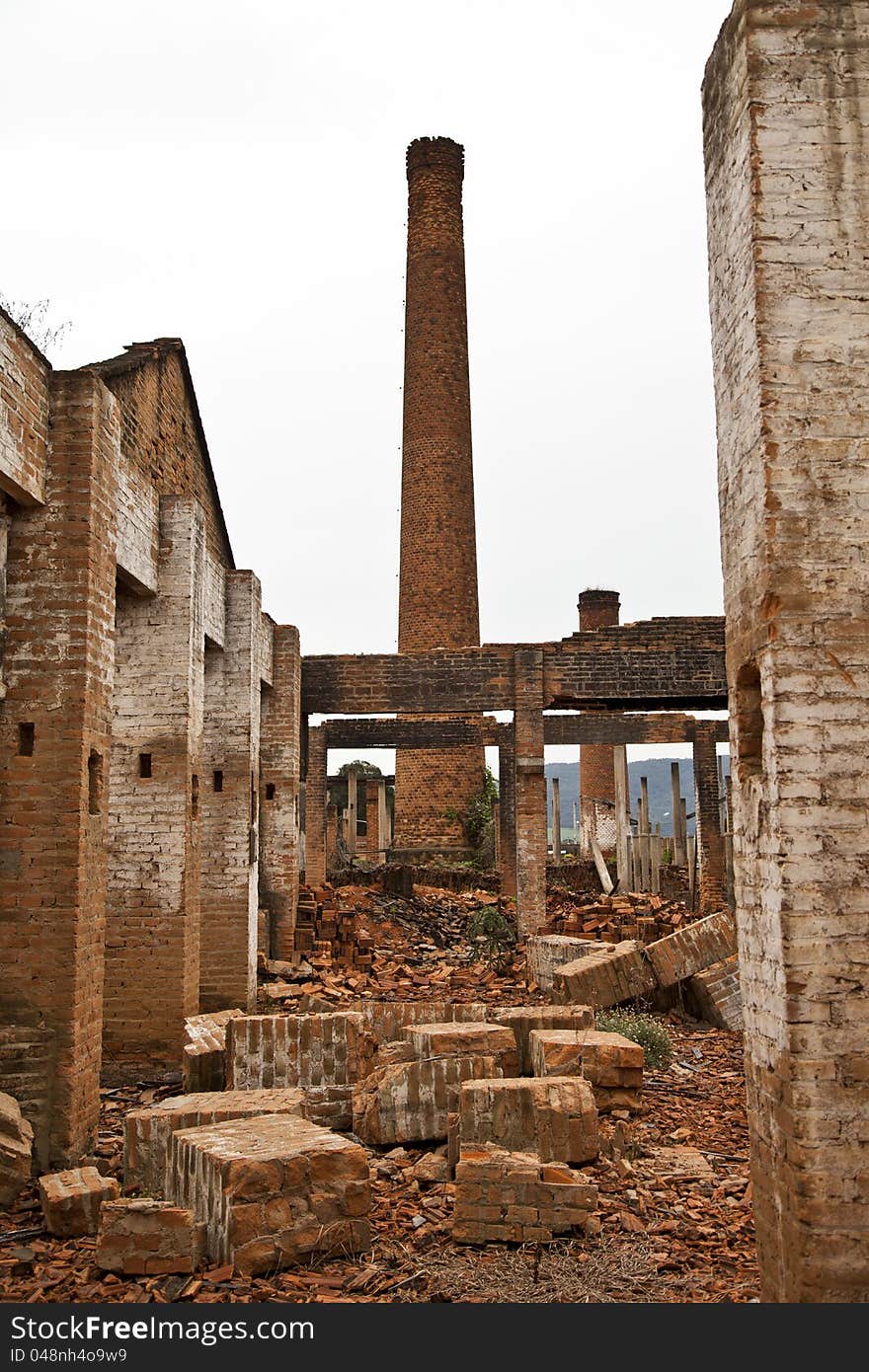 Ruins of a old plant / factory with industrial brick chimney