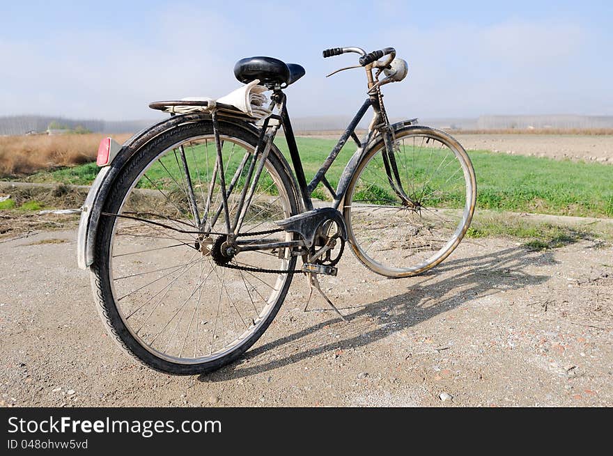 A big old bicycle in the rural environment