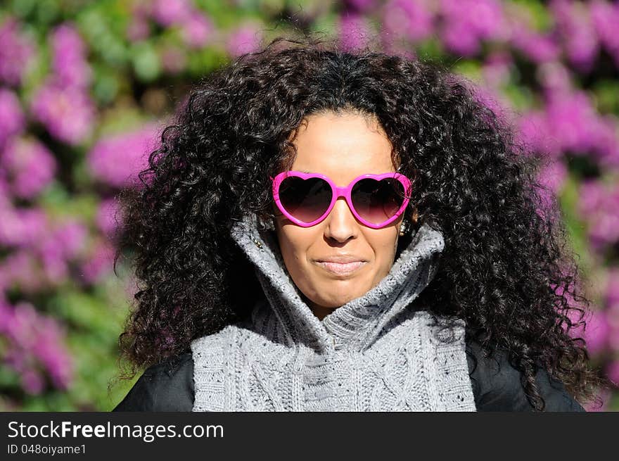 Portrait of a Funny black girl with purple heart glasses