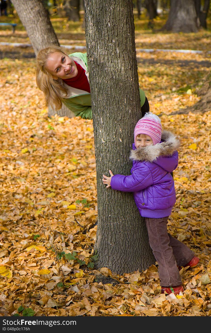 Woman  With Her Daughter In The Autumn Park