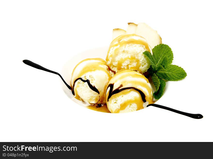 Ice cream balls with chocolate cream on a white background