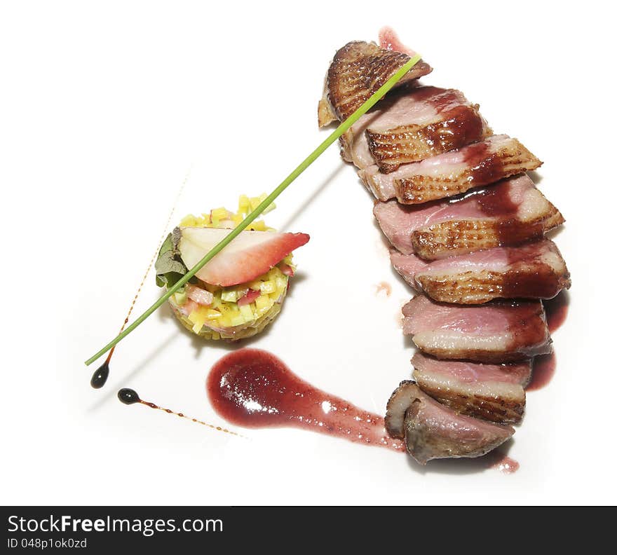 Grilled meat with vegetables on a white plate. Grilled meat with vegetables on a white plate