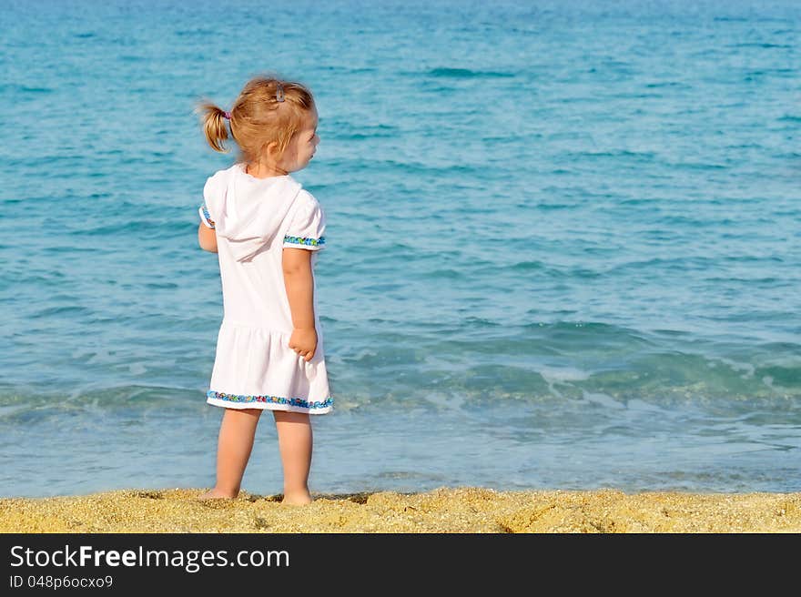 Happy child on the beach, summer vacation concept