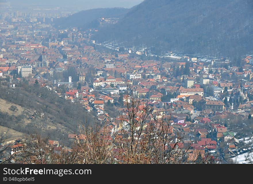 Aerial Brasov view from Poiana Brasov mountain. Brasov is one of the largest city in Romania, with great winter touristic attractions.