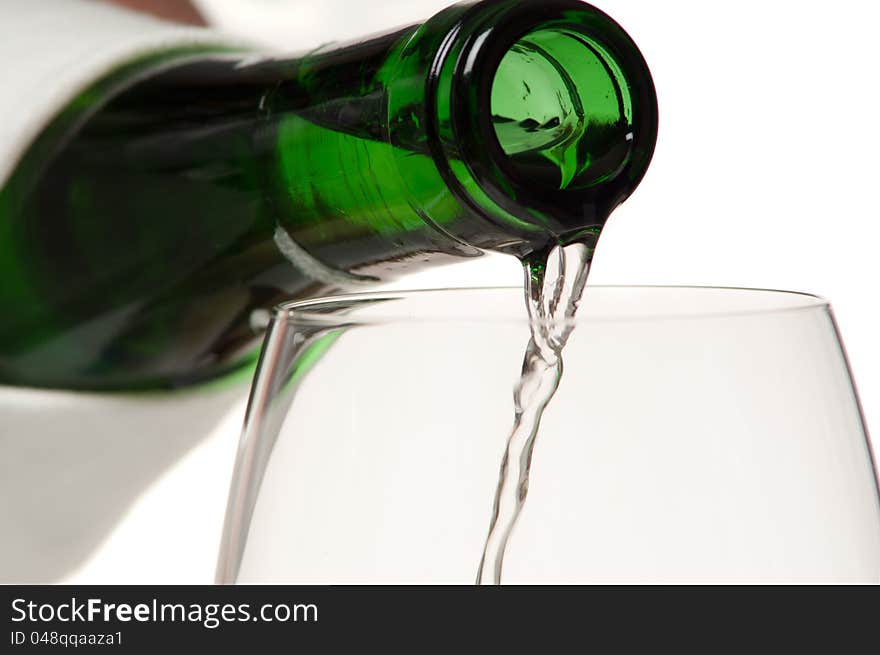 Wine bottle with a glass. Studio shot. White background.