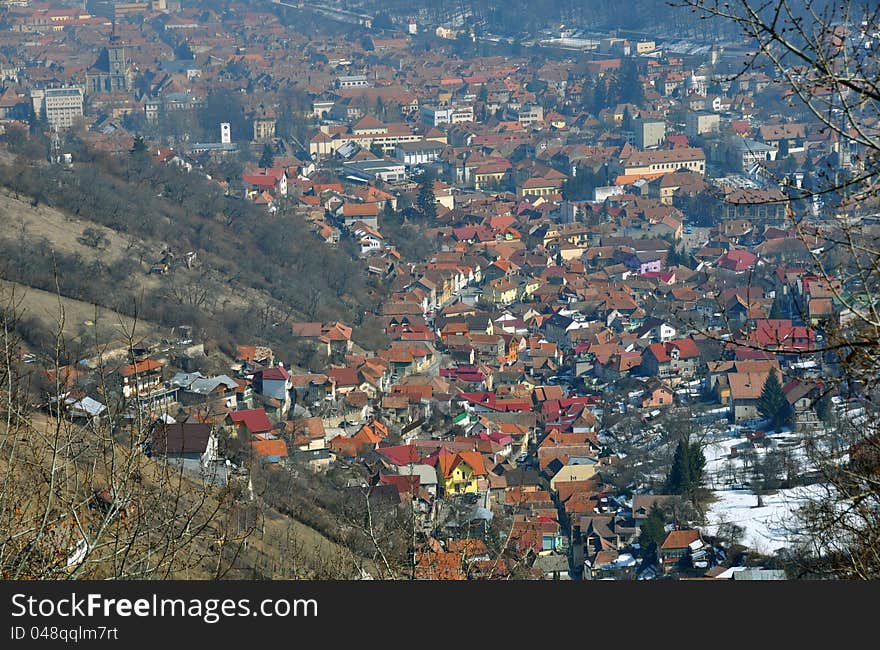 Aerial Brasov view from Poiana Brasov mountain. Brasov is one of the largest city in Romania, with great winter touristic attractions. Aerial Brasov view from Poiana Brasov mountain. Brasov is one of the largest city in Romania, with great winter touristic attractions.