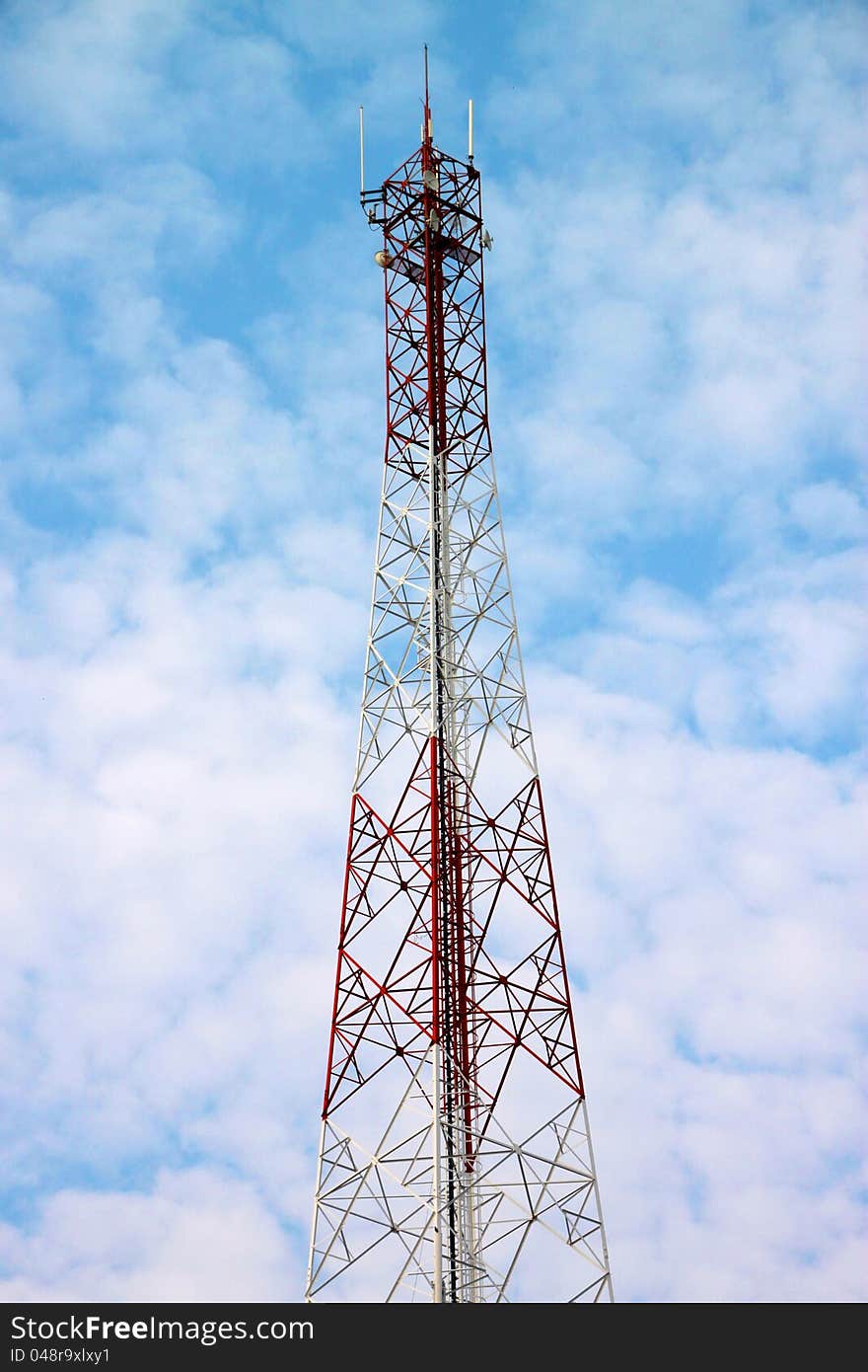 Very high antenna pole tower and blue sky