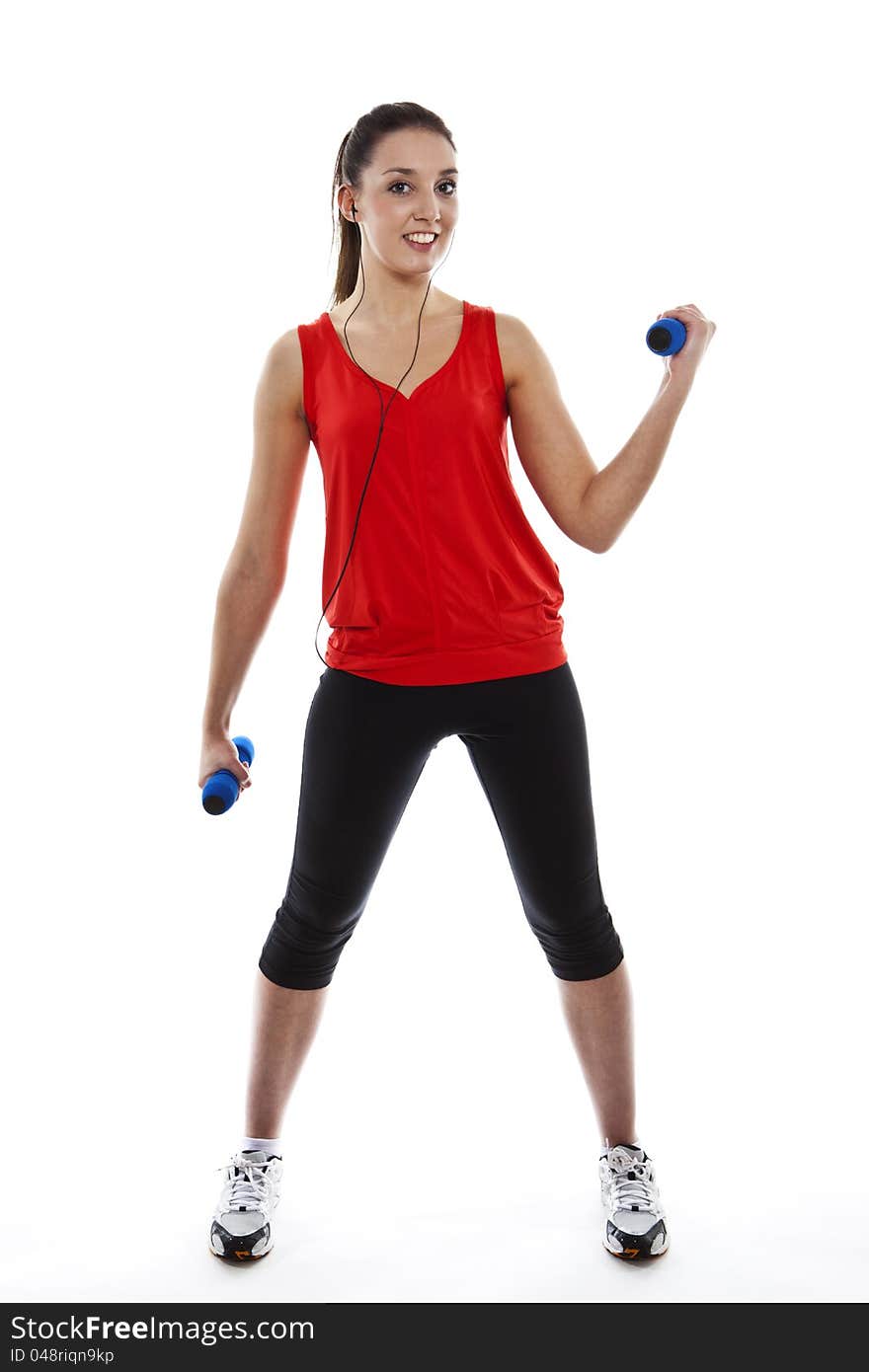 Young fit woman exercising with weights