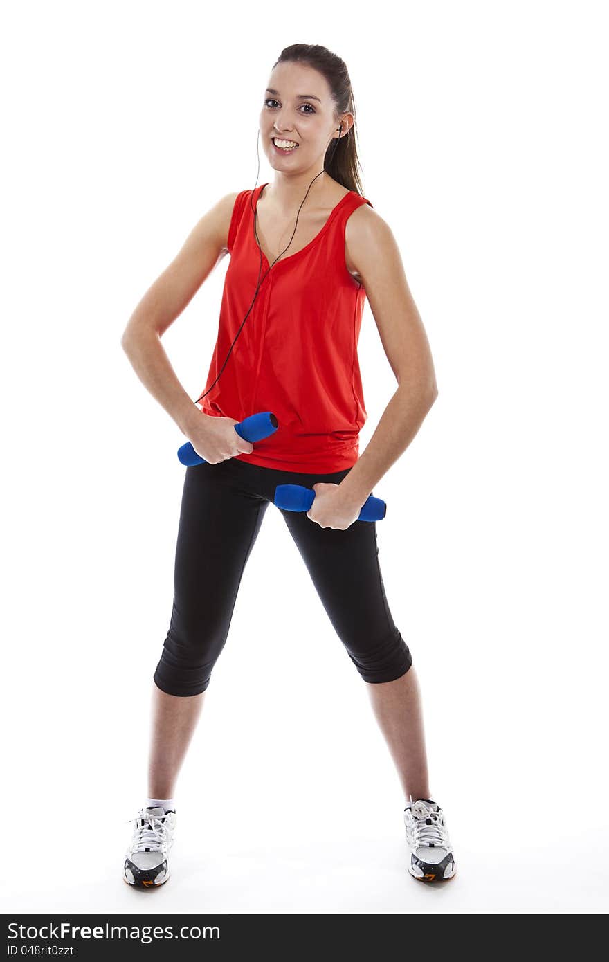 Young fit woman exercising with weights