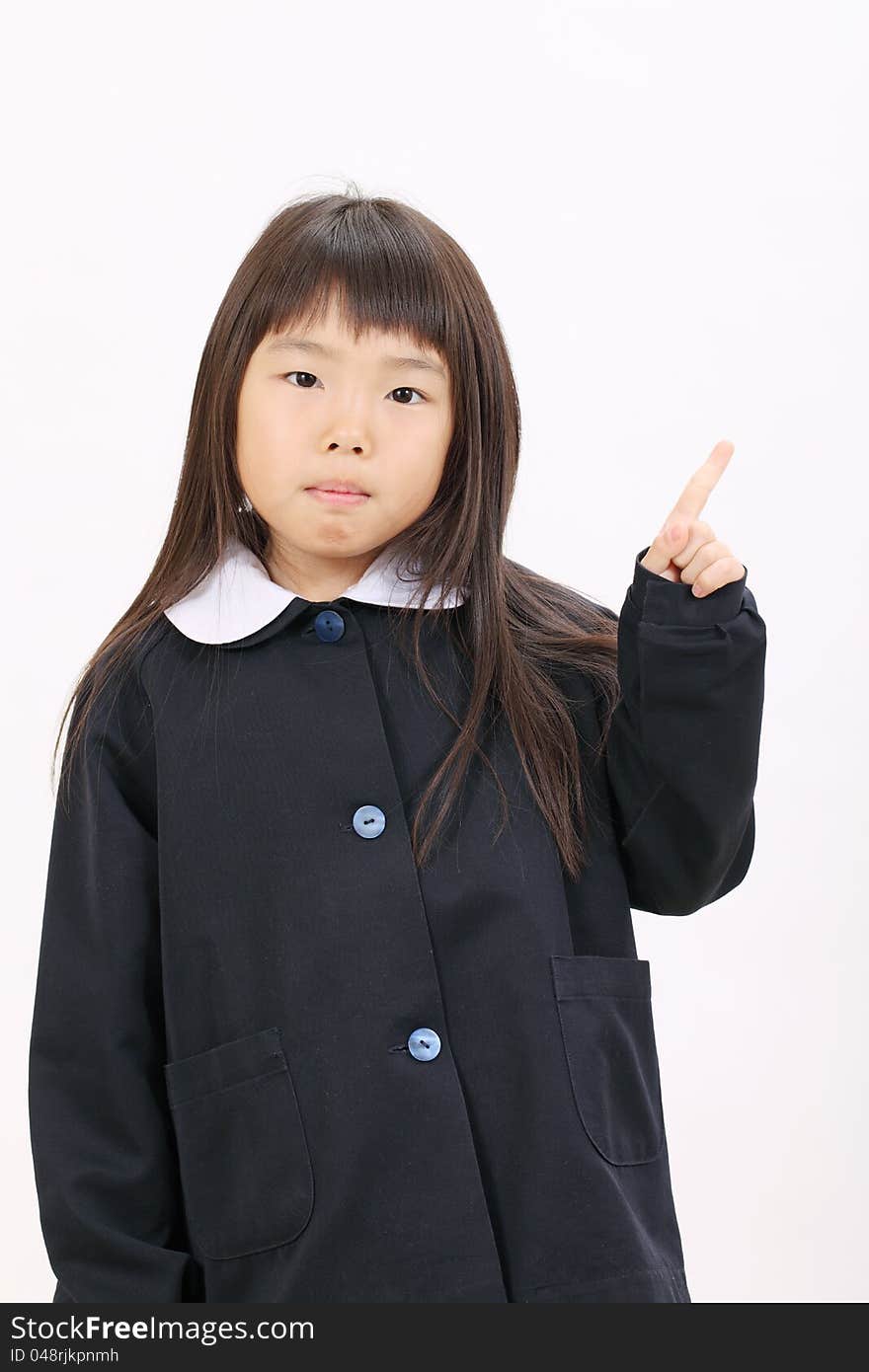 Little asian schoolgirl rise hand and pointing