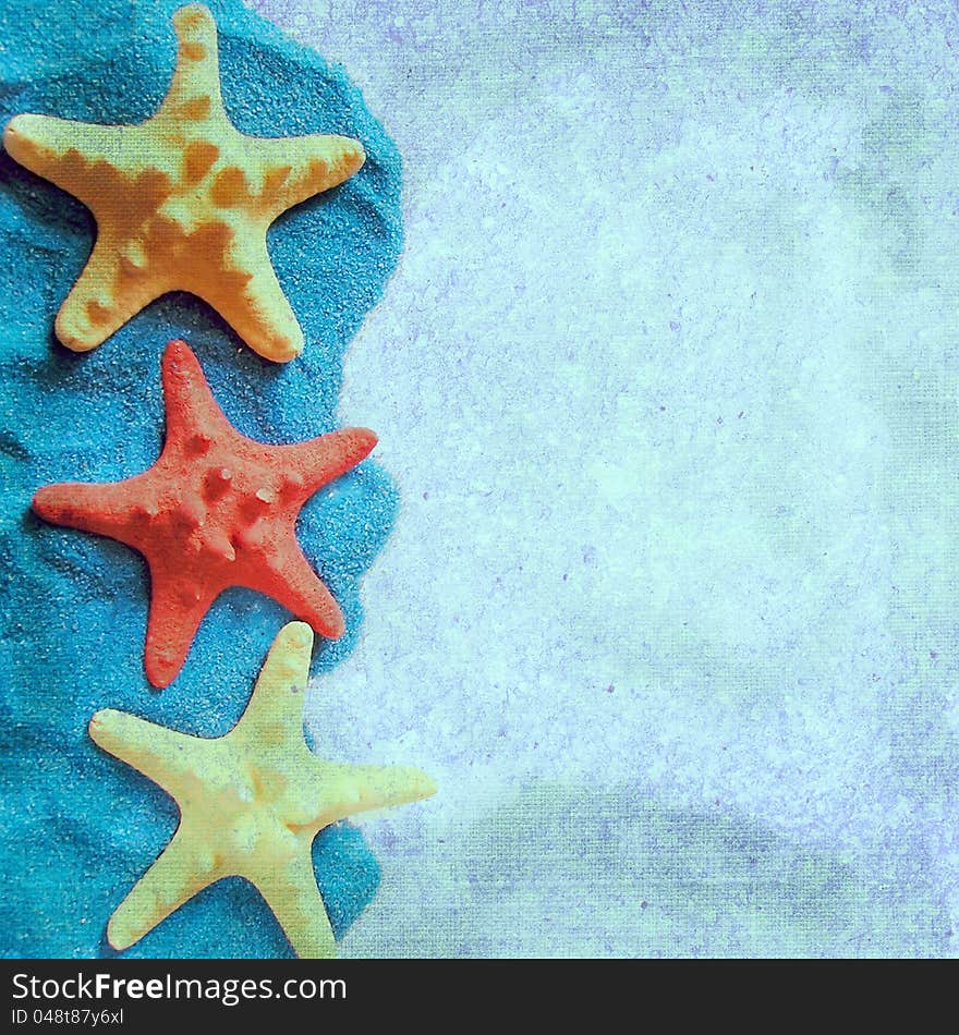 The square background with starfish on a blue sand. Page to design photo books