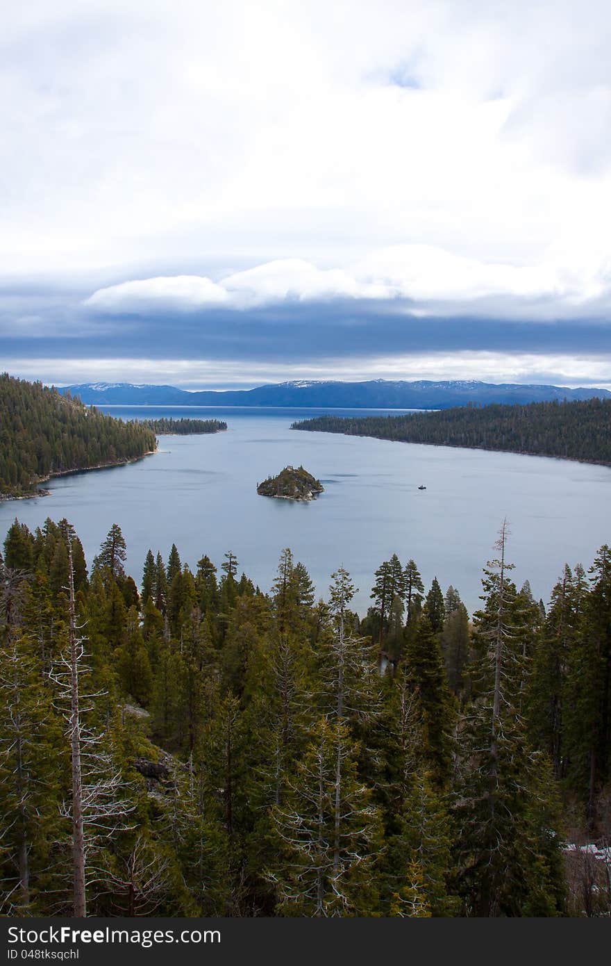 Views of Lake Tahoe in California with crystal clear water, snow on the ground, and mountains in the background. Views of Lake Tahoe in California with crystal clear water, snow on the ground, and mountains in the background.