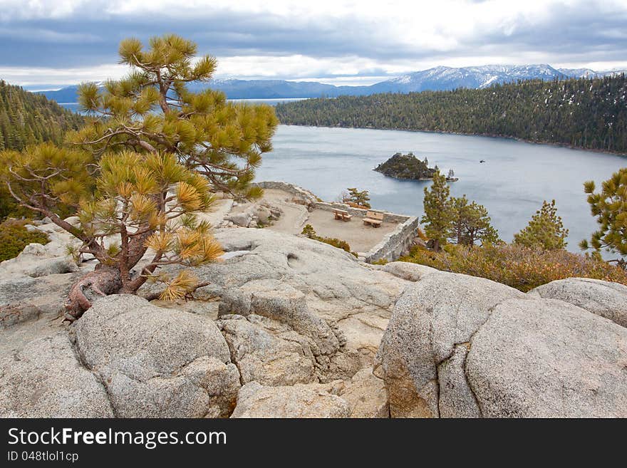 Views of Lake Tahoe in California with crystal clear water, snow on the ground, and mountains in the background. Views of Lake Tahoe in California with crystal clear water, snow on the ground, and mountains in the background.