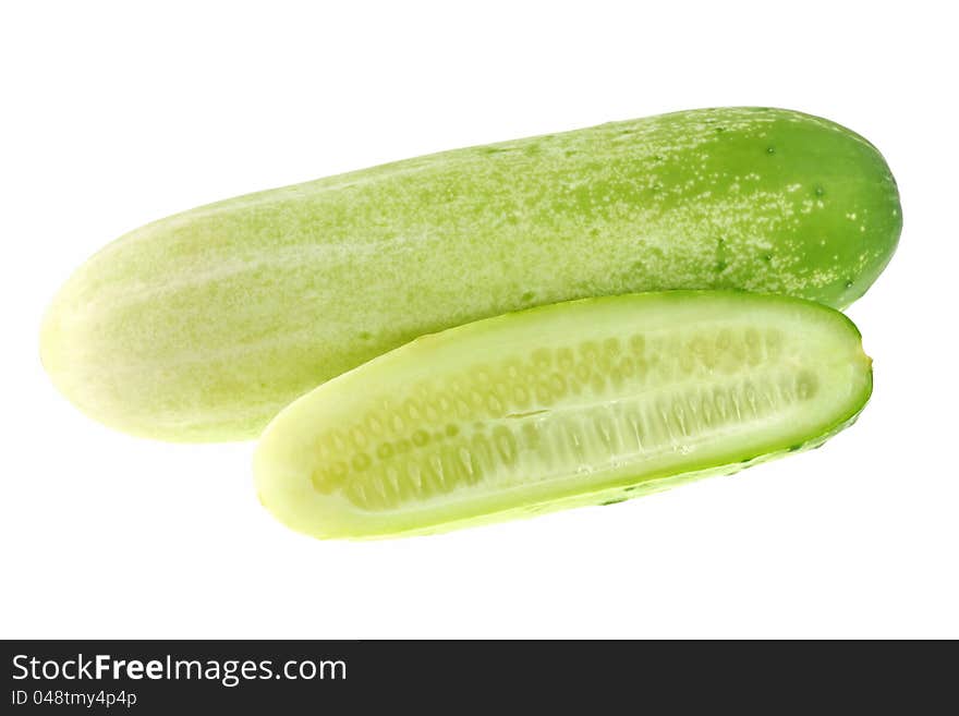 Closeup photo of fresh cucumber cut in half, isola