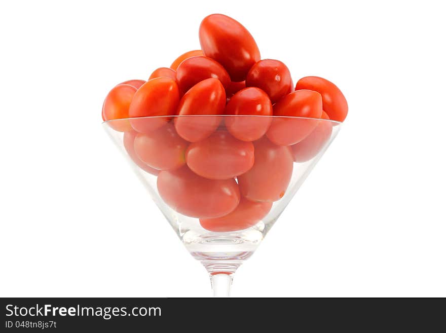 Closeup photo of fresh Cherry Tomatoes (Cocktail tomato) in a cocktail glass, isolated on white background. Closeup photo of fresh Cherry Tomatoes (Cocktail tomato) in a cocktail glass, isolated on white background