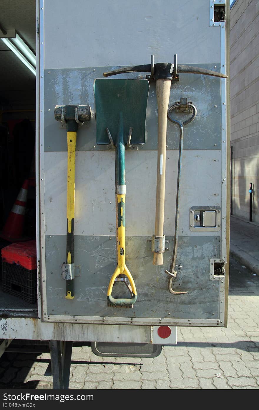 Closeup of an open truck backdoor with tools on it. Closeup of an open truck backdoor with tools on it