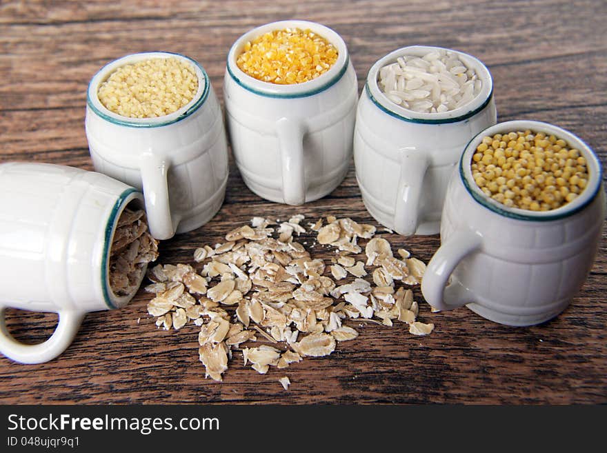 crop (rice and buckwheat, millet and porridge, couscous and  corn) in barrels. crop (rice and buckwheat, millet and porridge, couscous and  corn) in barrels