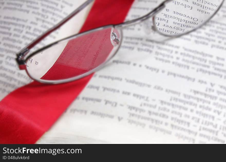 Book Reading Glasses And Red Bookmark