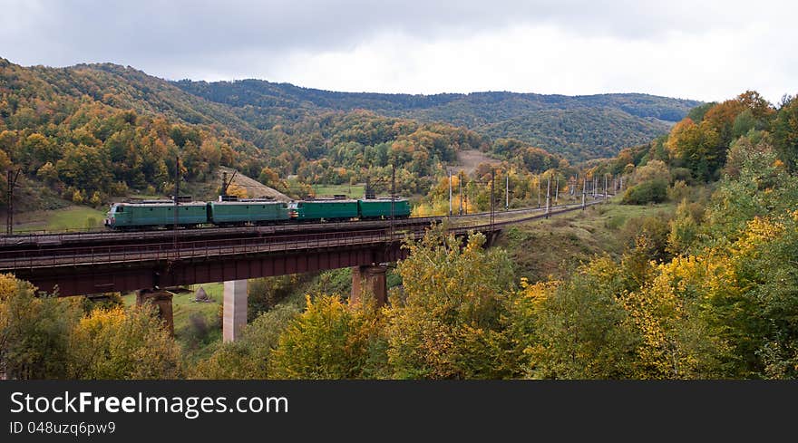 Electric Locomotives On The Bridge In Mountains