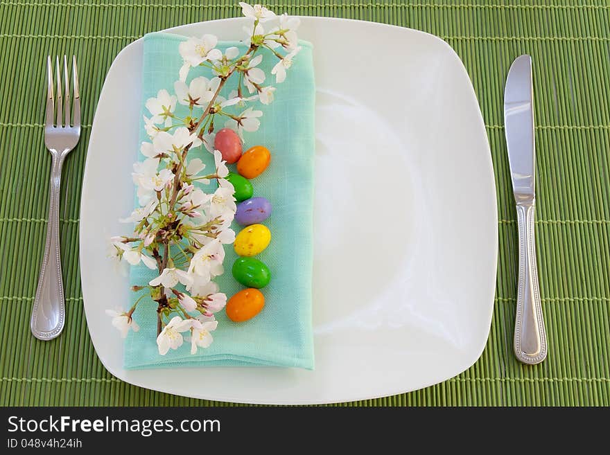 Easter place setting with spring flowers and blossom