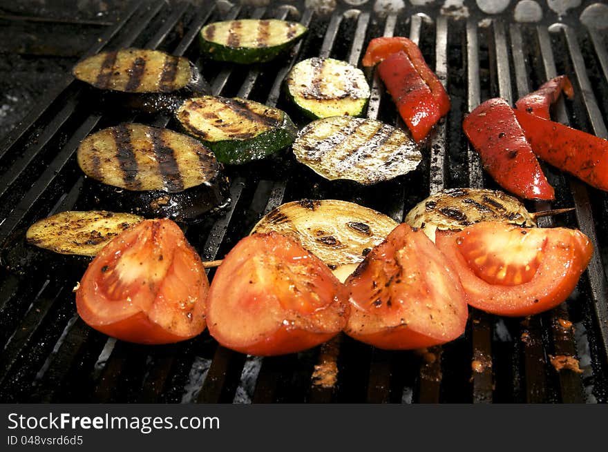 Vegetables on the grill over low heat for preparing