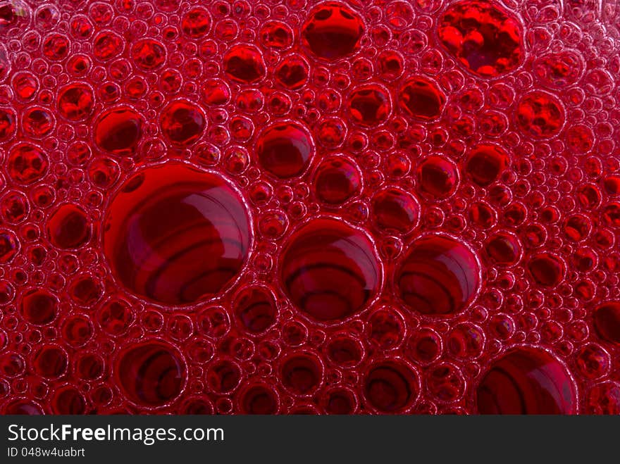 Bubbles of red wine from the different foreshortening  in glass. Bubbles of red wine from the different foreshortening  in glass