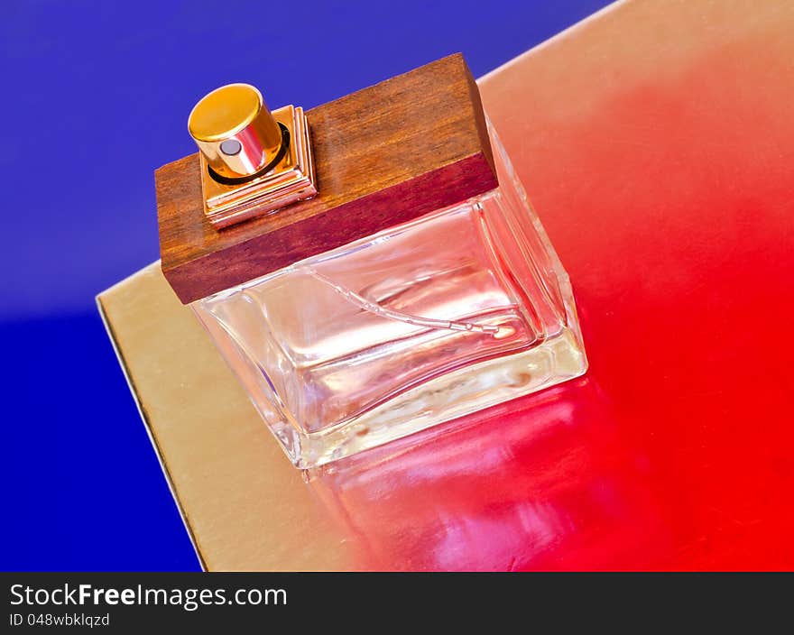 Perfume bottle on a colorful background.