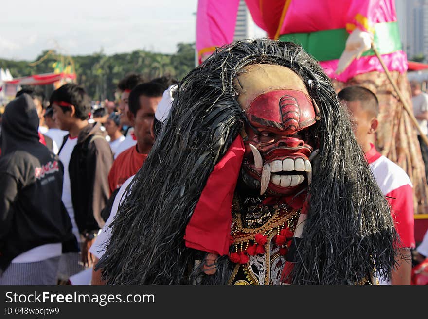 a barong is following ogoh-ogoh parade in Jakarta, the event was held the day before Nyepi. Barong is a lion-like creature and character in the mythology of Bali, Indonesia. He is the king of the spirits, leader of the hosts of good, and enemy of Rangda, the demon queen and mother of all spirit guarders in the mythological traditions of Bali.