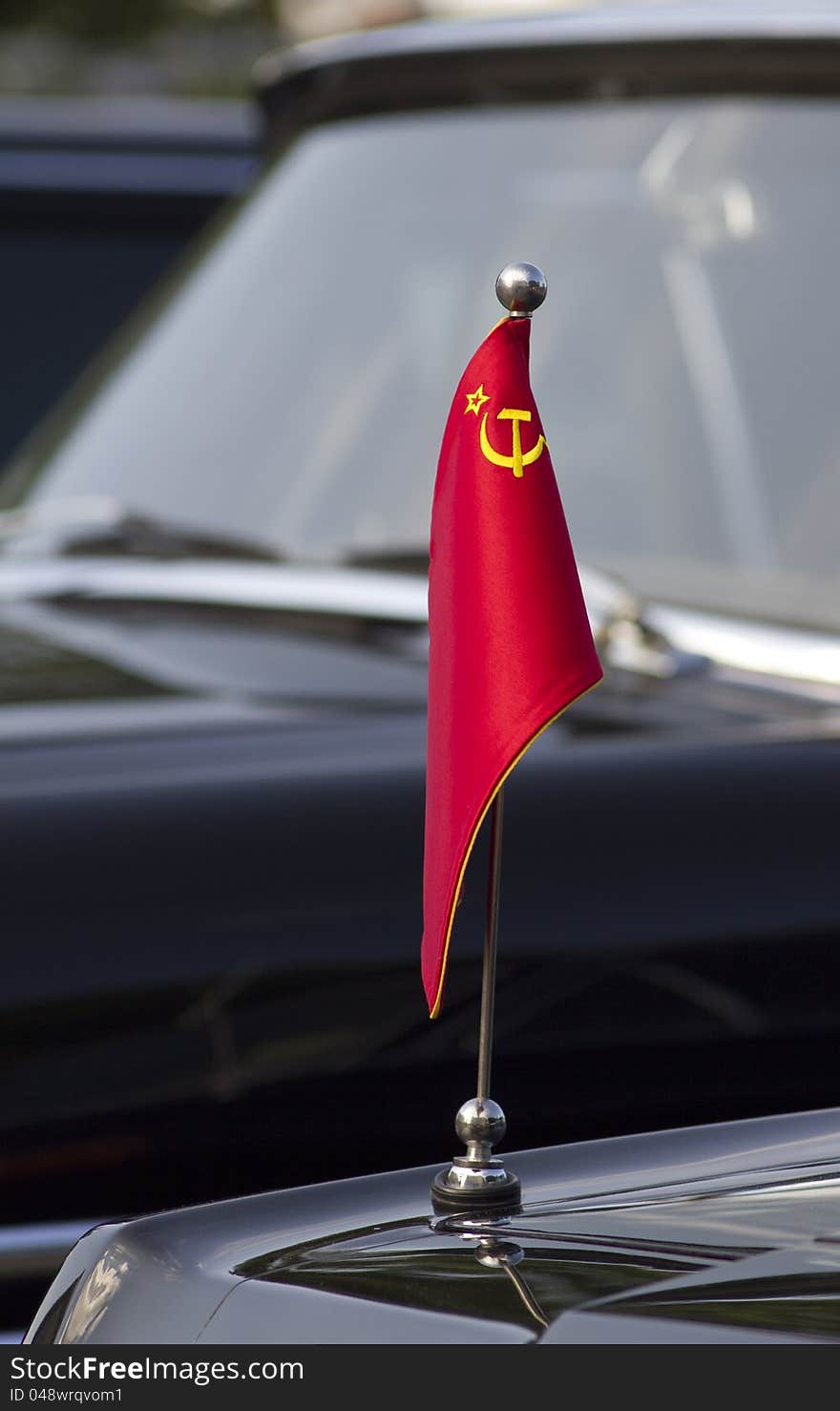 Soviet flag on the black limousine flagpole. Soviet flag on the black limousine flagpole