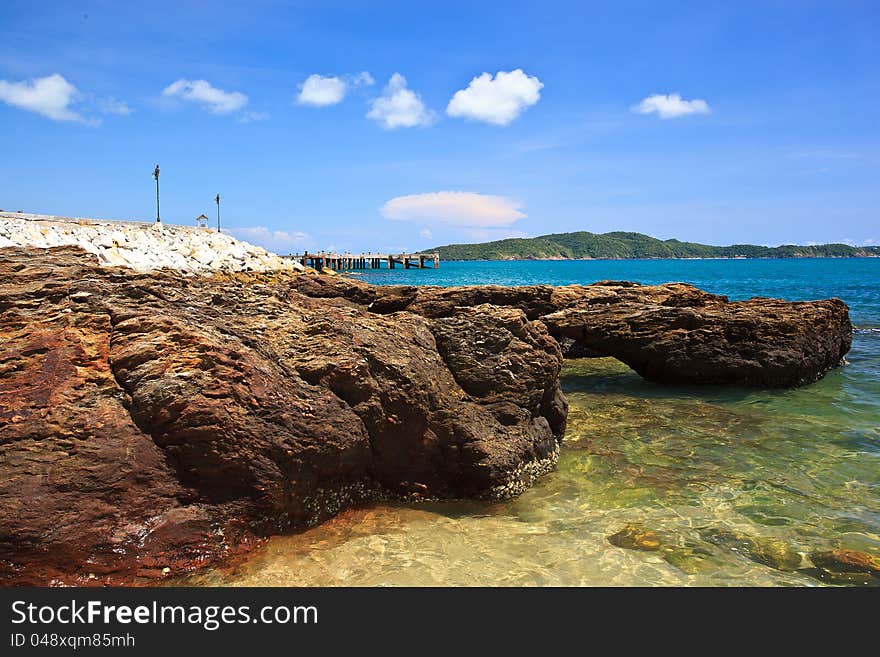 Sea beach and rock on blue sky