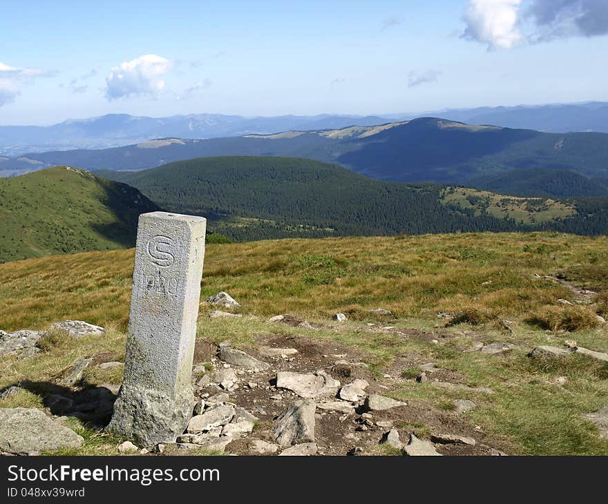 Old border Sign (1920) of  Czechoslovakia and Poland in Carpathian Mountains. Ukraine. Old border Sign (1920) of  Czechoslovakia and Poland in Carpathian Mountains. Ukraine