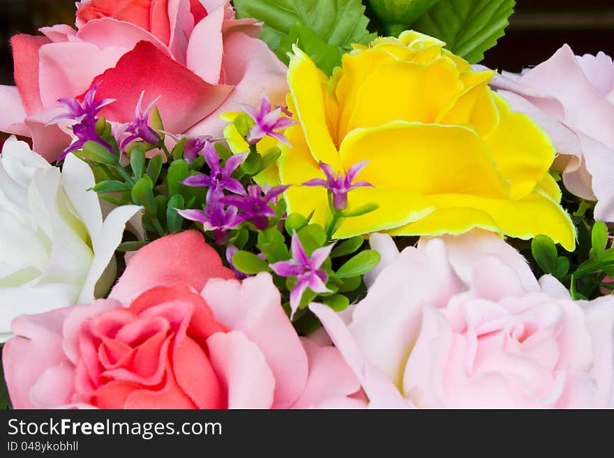 Artificial yellow roses.