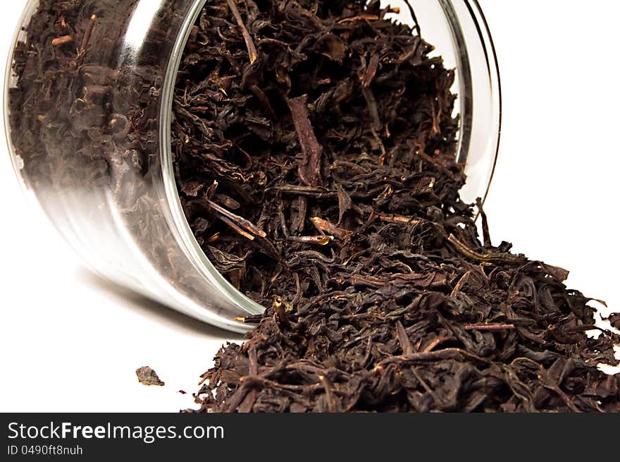 Tea in a glass jar on white background. Tea in a glass jar on white background