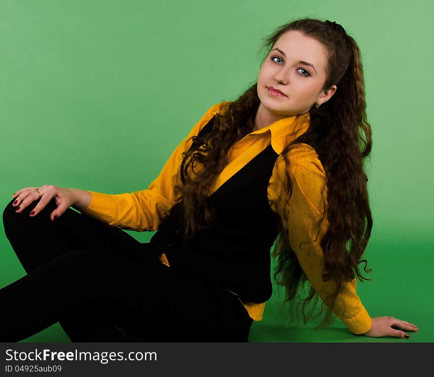 Portrait of sitting beautiful  brunette woman