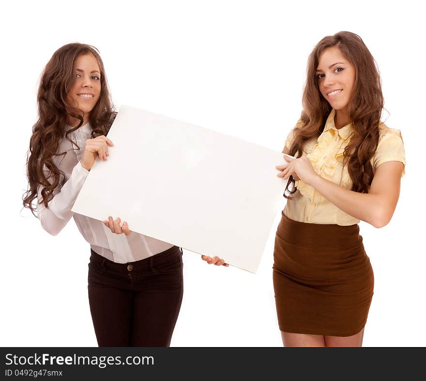 Gemini sisters hold a poster on a white background. Girls working in the office.