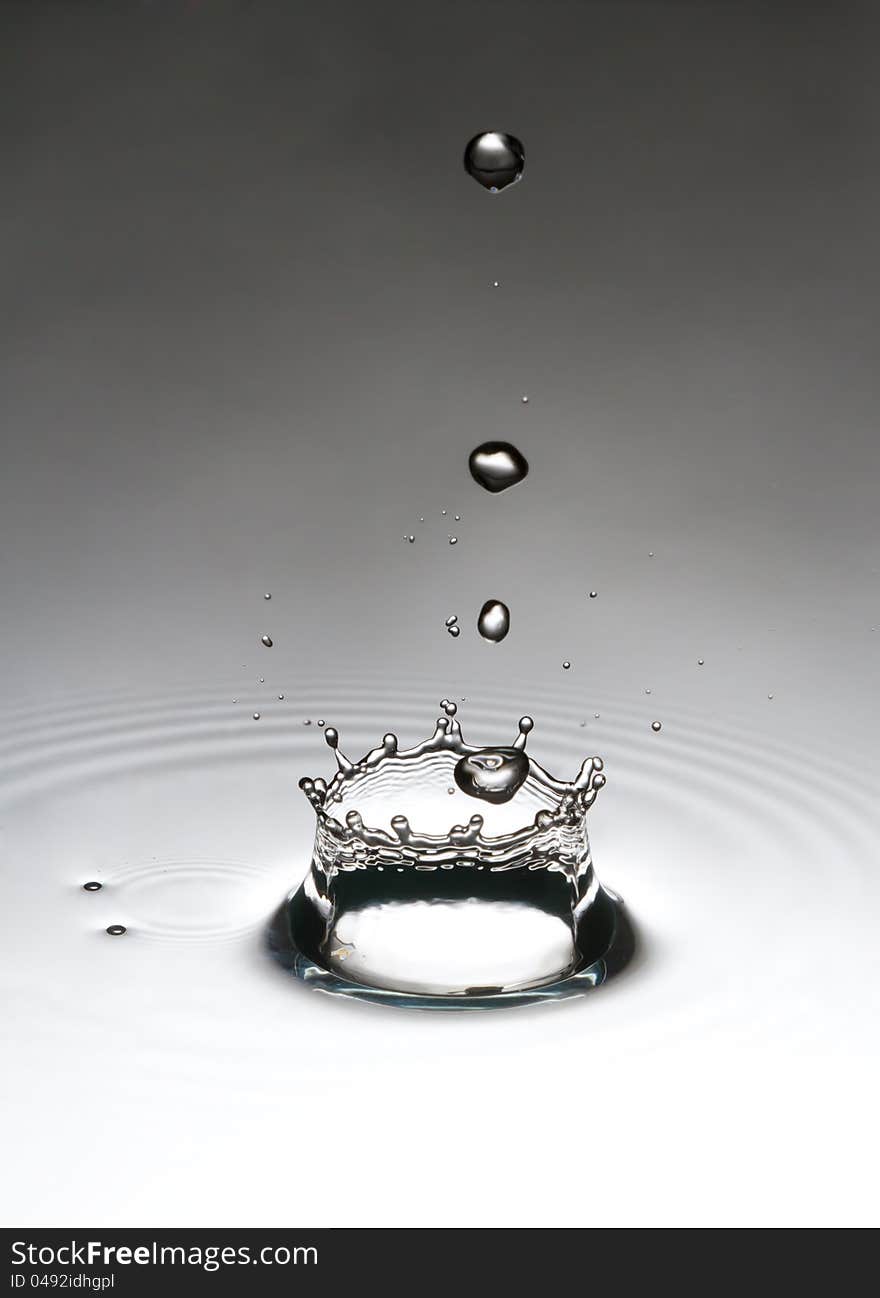 The drop, which falls into the water. Spray fly like a crown.