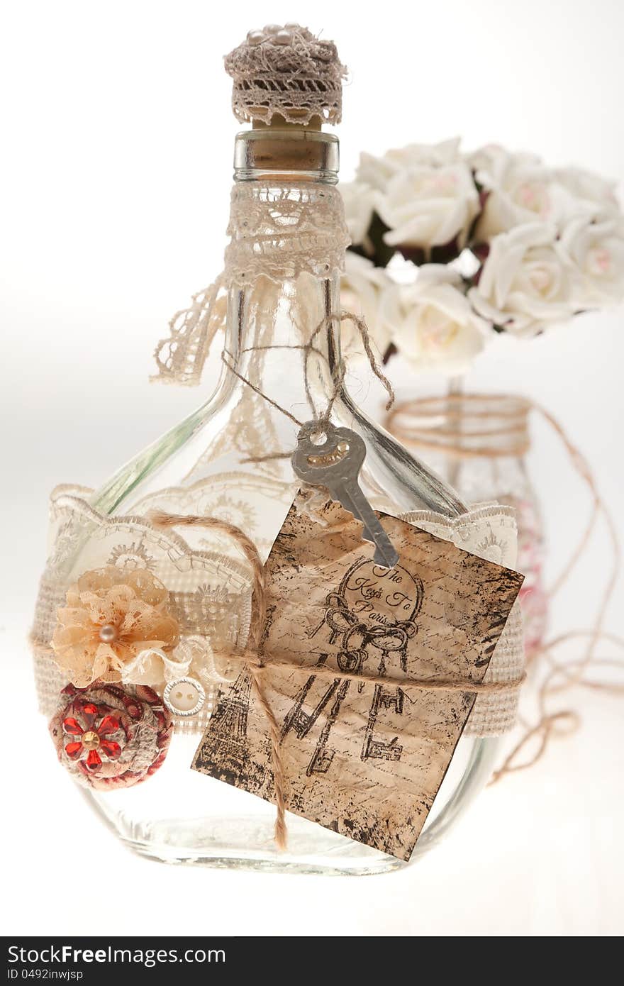 Bouquets and bottles on a white background. Ornaments in the form of ropes.