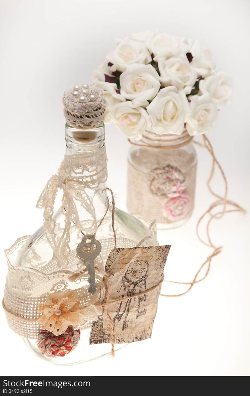 Bouquets and bottles on a white background. Ornaments in the form of ropes.